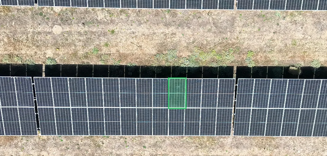The raw RGB frame of the same row. The panel is marked with the same green box.